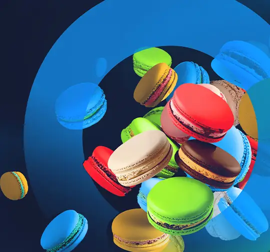 Hauptgrafik Acquiring: Macarons in allen Computop-Farben fliegen durch ein stilisiertes Computop Paygate
